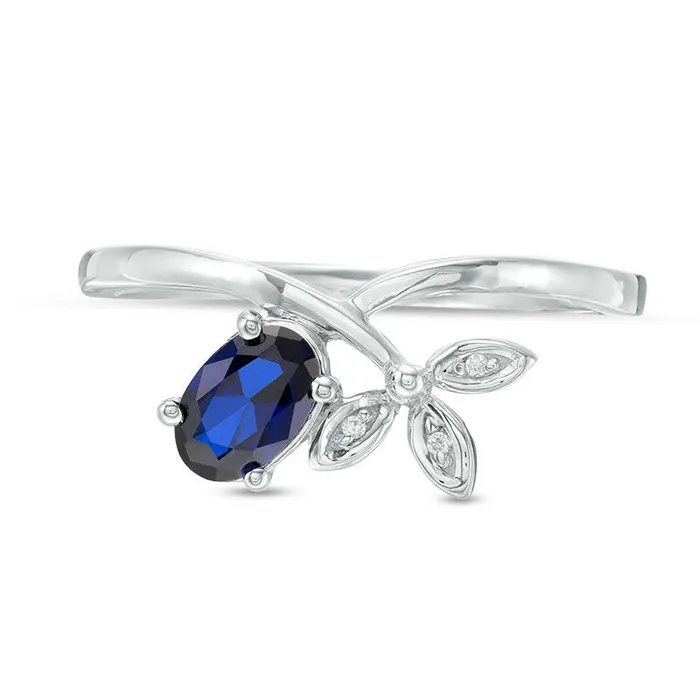 Rings Goldia Oval LabCreated Blue Sapphire and Diamond Accent TriLeaf Crossover Promise Ring in Sterling Silver Rings Goldia Oval LabCreated Blue Sapphire and Diamond Accent TriLeaf Crossover Promise Ring in Sterling Silver